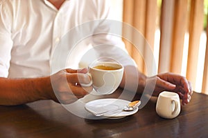 Cropped shot of young businessman with coffee