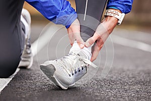 Cropped shot of a young man holding his ankle in pain sprain a f