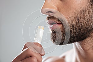 Cropped shot of young man with ?olorless lipstick