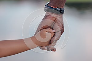 cropped view of african american grandfather holding hands