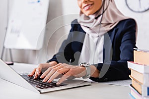 cropped view of Arabian businesswoman work
