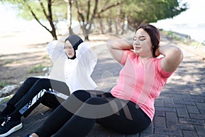 cropped view asian women sit up