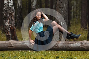 Cropped view of beautiful young woman walking in forest