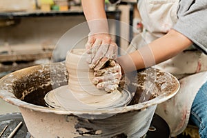Cropped view of blurred female ceramicist photo