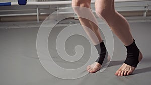 Cropped view of boxer jumping on skipping rope