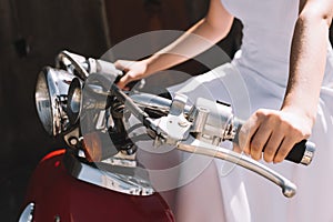 cropped view of bride sitting