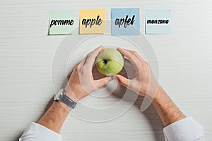 Cropped view of businessman holding apple