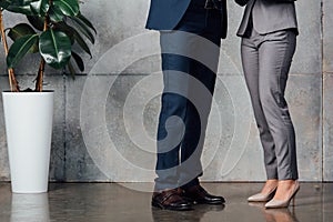 Cropped view of businesspeople in formal wear