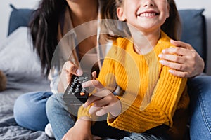 Cropped view of child watching tv