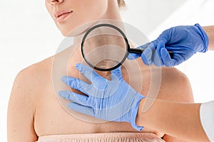 Cropped view of dermatologist examining skin