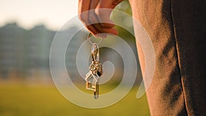 Cropped view female hand African American woman girl realtor buyer holding bunch of keys to new house own flat home