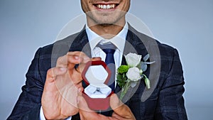 cropped view of happy groom showing