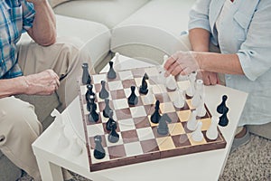 Cropped view of her she his he two nice intelligent people playing chess creating move strategy win winner amateur