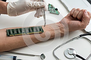 cropped view of male hand with microchip and syringe for microchipping on table