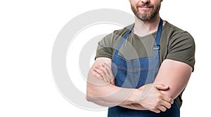 cropped view of man in apron isolated on white background. crossed hands