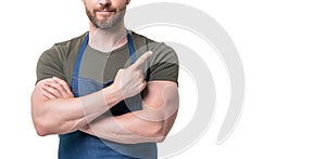 cropped view of man in apron isolated on white background. point finger