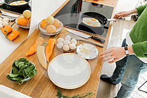 Cropped view of man cooking eggs