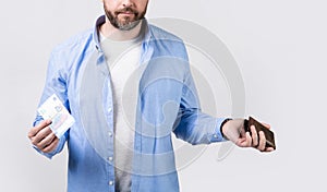 cropped view of moneyless man with wallet at hand. photo of moneyless man with wallet.