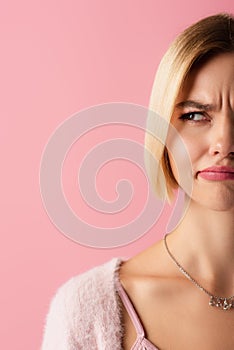 cropped view of uncertain young woman