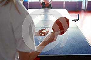 Cropped view of woman playing table tennis