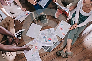 cropped view of young businesspeople sitting