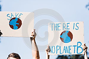 Cropped of volunteers holding placards with