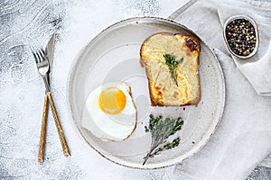 Croque Monsieur a traditional French toasted cheese and ham sandwich with bechamel sauce. White background. Top view