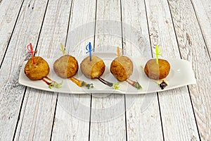 Crunchy croquette on the outside and so creamy on the inside that it melts in your mouth. photo