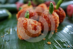 Croquette is food from potato wadding containing minced meat that is seasoned and mixed with vegetables