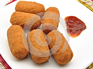 Croquettes with tomato sauce