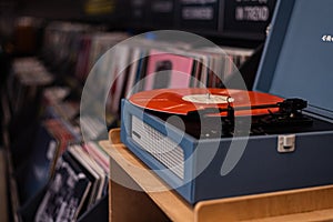 crosley Vintage vinyl record player on the background of a music store window. Kazakhstan, Almaty, December 27, 2023