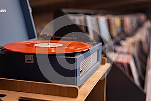 crosley Vintage vinyl record player on the background of a music store window. Kazakhstan, Almaty, December 27, 2023