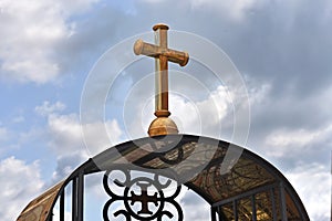 Cross against the background of a blue background. Symbol of God, Christian, Easter