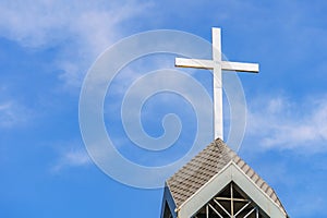 Cross as a religious symbol of Christianity. Background with selective focus and copy space