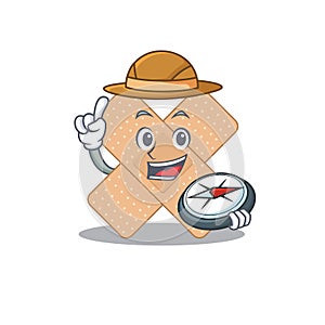Cross bandage mascot design style of explorer using a compass during the journey