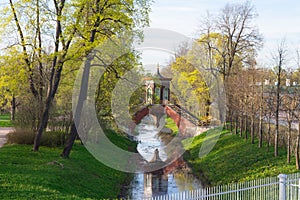 Cross the bridge to the pavilion over the Krestovy canal in the Alexander Park