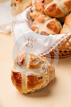 Cross buns and basket with a white napkin