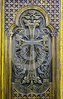 Cross carved on wooden door