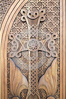 Cross carved on wooden door