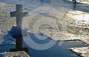 Cross christian symbol made from a block of ice