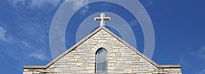 Cross on Church Steeple of Old Christian Stone Temple