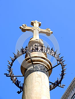 Cross on a column in Santa Maria del Fiore Square, in Florence, Tuscany, Italy