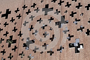 Cross concept in rusty steel facade