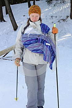 Cross contry skiing with sling and newborn baby