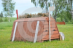 A cross-country a brush fence in a cross country event