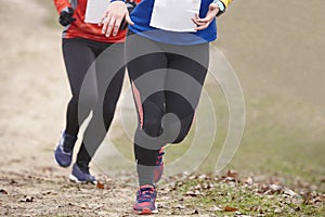 Cross country female runners on a race. Active lifestyle