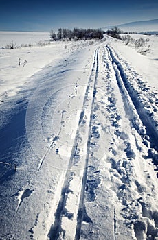 Cross-country ski run through snowy landscape