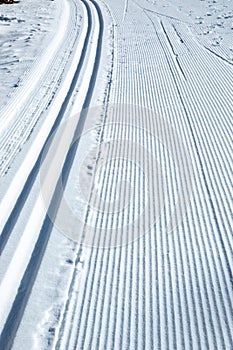 Cross-country ski tracks ruts and shoveling