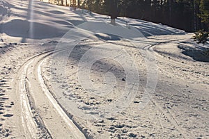 Cross country ski trails outdoors in sunny day.