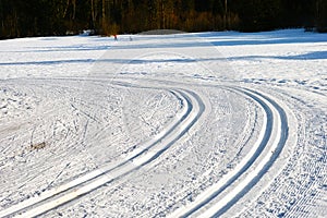 Cross country ski trails in snowy field winter season patterns